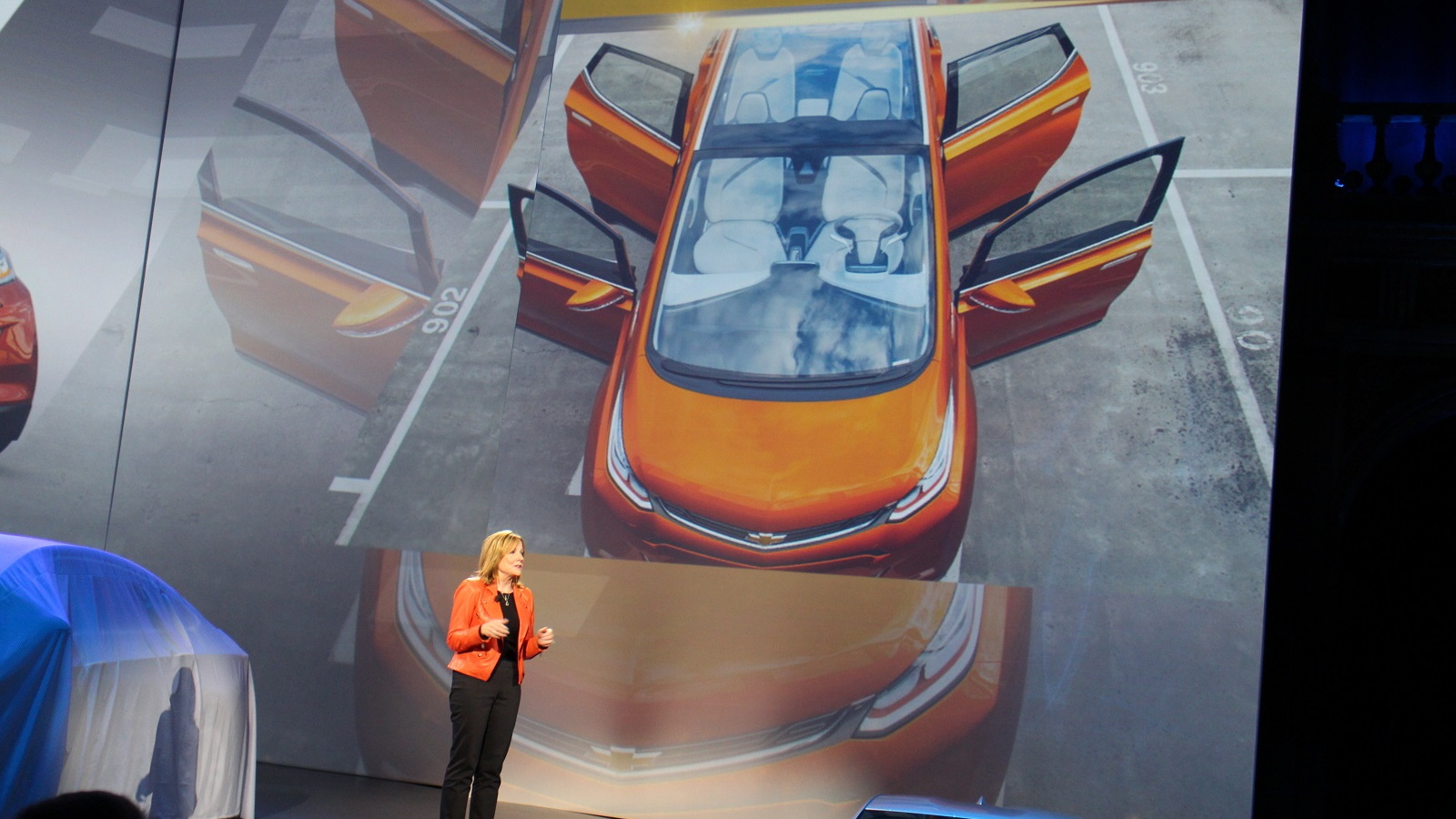 GM CEO Mary Barra and Chevy Bolt EV electric car image at 2016 Chevrolet Cruze launch, Jun 2015