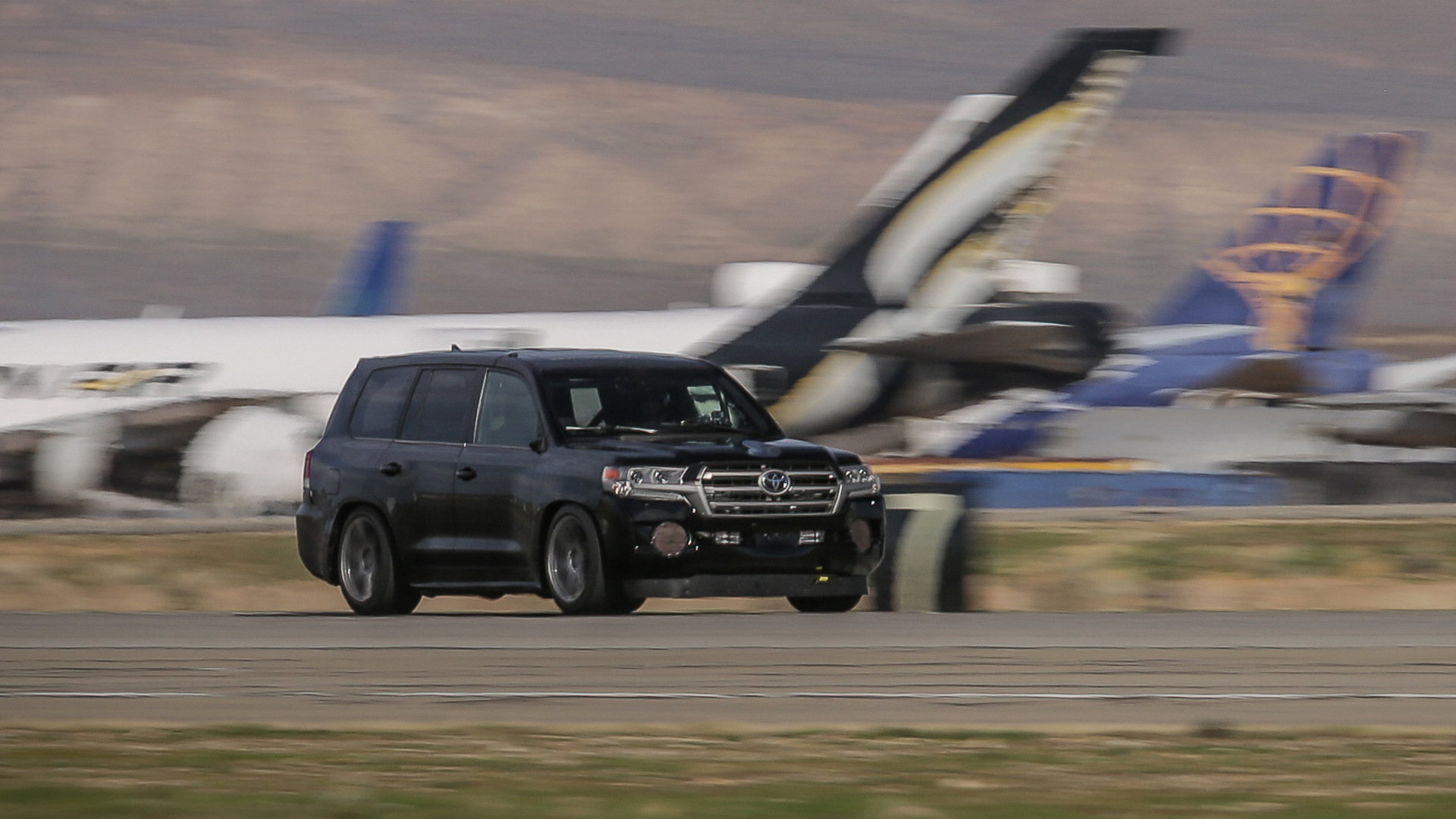 Carl Edwards drives the Toyota Land Speed Cruiser to 230.02 mph in Mojave, California