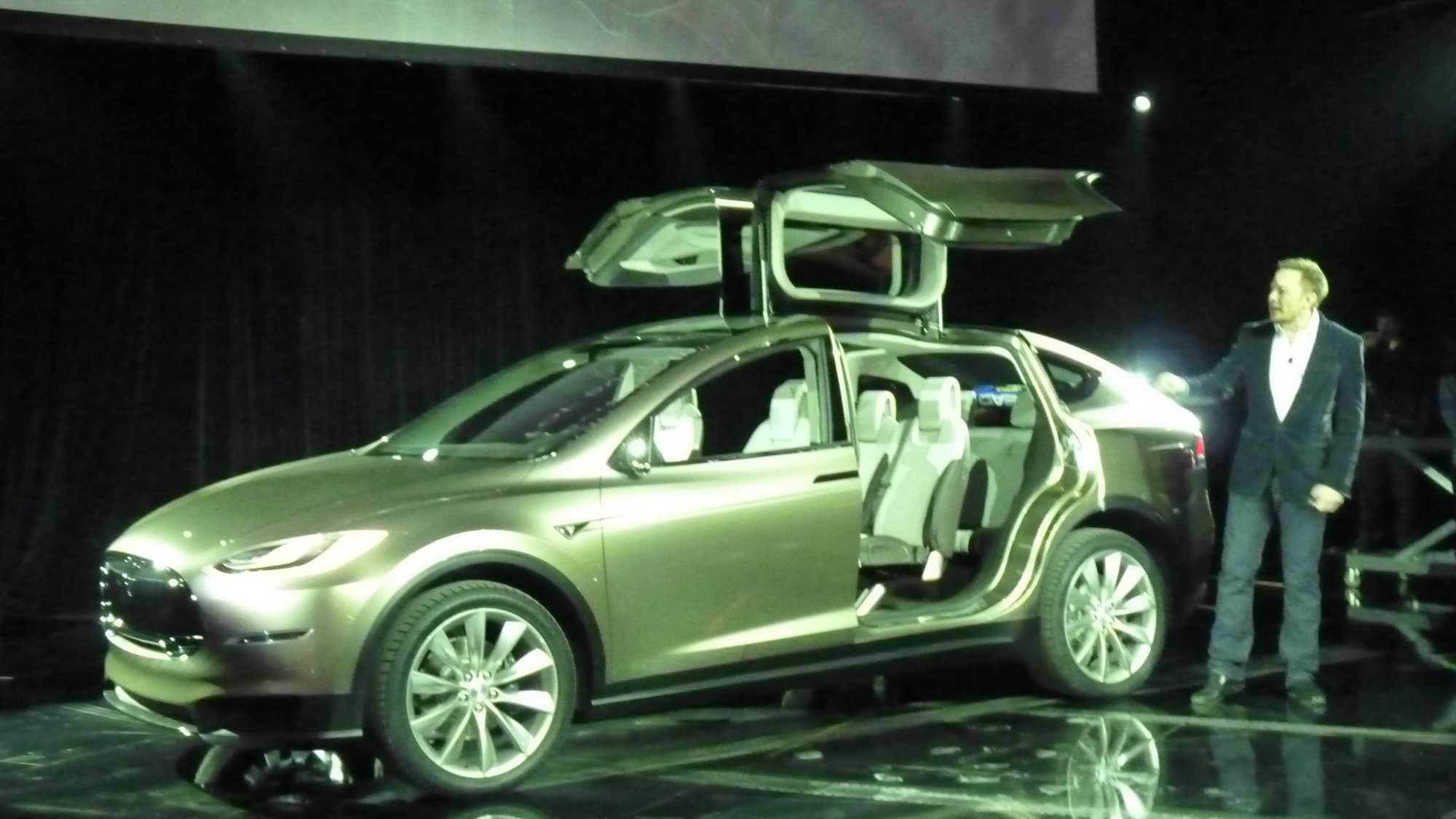 Tesla CEO Elon Musk, demonstrating the Model X third-row seat and falcon doors