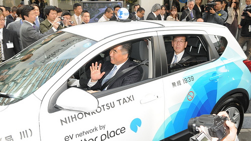 Nissan electric taxi leaving Better Place battery switching station, Tokyo, April 2010
