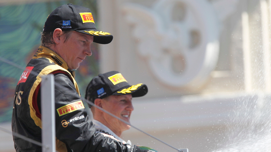 Raikkonen and Schumacher on Valencia podium - Lotus F1 team photo