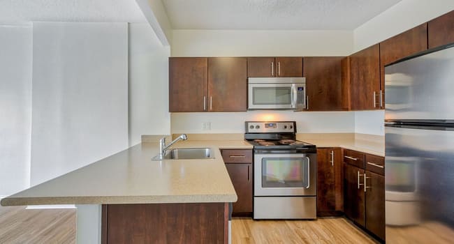 Kitchens are complete with stainless steel appliances