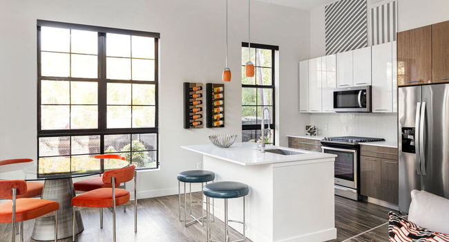 The chef-inspired kitchens feature gas stoves, stainless steel appliances and quartz countertops
